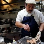 FILE PHOTO: Hot’s Kitchen Sous Chef Aaron DuBois prepares foie