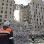 Rescuers work at a site of the regional administration building
