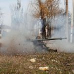 Service members of pro-Russian troops fire an anti-tank grenade launcher
