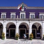 A man passes by the City Hall in Setubal