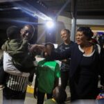 Zimbabweans evacuated from Sudan to escape the conflict arrive at