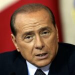 FILE PHOTO: Italian Prime Minister Silvio Berlusconi answers a journalist’s