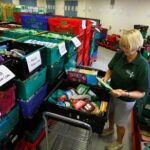 Christine Manning, a volunteer at the charity Greenwich Foodbank, prepares