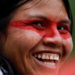 Indigenous Waorani woman Elisa Enkeri smiles in the Bameno community,