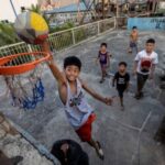 The Wider Image: In FIBA World Cup host Philippines, basketball