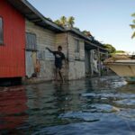 FILE PHOTO: The Wider Image: Rising sea levels are forcing
