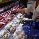A customer browses through locally caught seafood at the Hamanoeki
