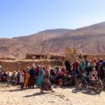 Earthquake survivors wait for aid in the village of Ighil