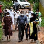 Members of a medical team from Kozhikode Medical College carry