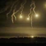 Flares are pictured over Gaza Strip, seen from southern Israel