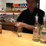 Taiko Nakamura pours a dram of whisky in the tasting