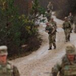 British troops part of the NATO reinforcements patrol at the