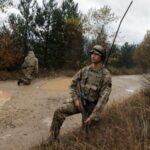 British troops part of the NATO reinforcements patrol at the