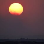 The sun sets over Gaza, as seen from southern Israel