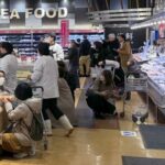 Shoppers crouch down as an earthquake hit the region at