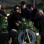 Family and friends take part in the funeral of Leonard