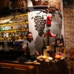 A barman works at a bar in Istanbul
