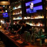 Barmen wait for customers at a bar in Istanbul