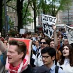 Students and employees of the University of Amsterdam protest against