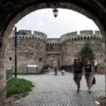 FILE PHOTO: People walk at the Kalemegdan fortress in Belgrade,
