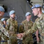 Britain’s Prince William, Prince of Wales, speaks to military personnel