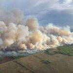 Smoke rises from mutual aid wildfire GCU007 in the Grande