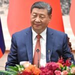 Chinese President Xi Jinping looks on during meeting with Russian