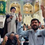 Iranian Shi’ite pilgrims pray for Iran’s President Ebrahim Raisi following