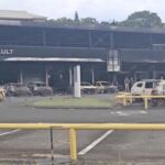 A view of burnt cars in a showroom in Noumea