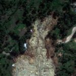 A satellite image shows buried homes after the landslide in