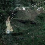 A satellite image shows a closer view of the landslide