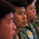 Air Force pilots listen while Taiwan’s President Lai Ching-te (not