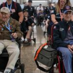 World War II Veterans preapre to travel to Normandy, France