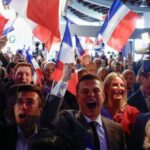 far-right National Rally (Rassemblement National – RN) party members react