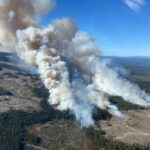 FILE PHOTO: Smoke rises from the  Burgess Creek wildfire