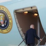 Biden boards Air Force One as he departs Washington for