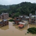 FILE PHOTO: Drone view shows houses submerged in floodwaters following