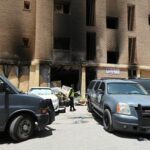 Aftermath of a deadly fire in a building, in Mangaf