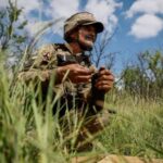 Ukrainian service members attend military drills near a frontline in