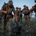 Ukrainian service members attend military drills near a frontline in