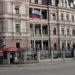 Russia’s flag flutters in front of the Russia’s Embassy in