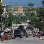 FILE PHOTO: Police patrol the streets of Port-au-Prince amid rampant