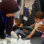 Malnourished Palestinian children receive treatment at the IMC field hospital
