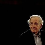 FILE PHOTO: U.S. linguist and philosopher Noam Chomsky pauses while