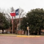 A Texas State flag flies outside of Dawson County Government