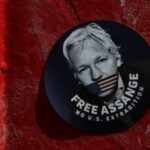 A sticker depicting Julian Assange in London