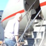 WikiLeaks founder Julian Assange boards a plane at a location