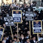 FILE PHOTO: Ultra-Orthodox Jewish men protest against attempts to change