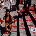Activists pour red paint on the Spanish Steps to protest