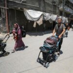 Palestinians flee their homes following an Israeli military operation in